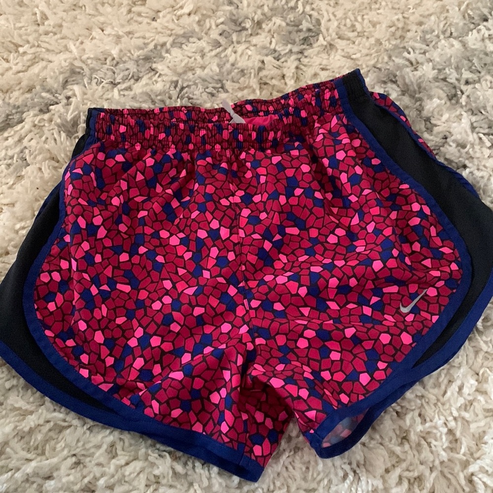 Pink blue and black patterned running shorts.